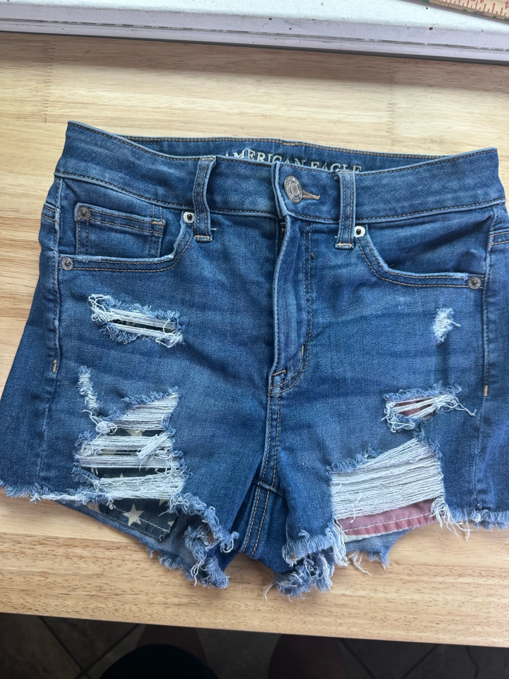 American Eagle Outfitters Distressed Blue Jean shorts American flag underlay